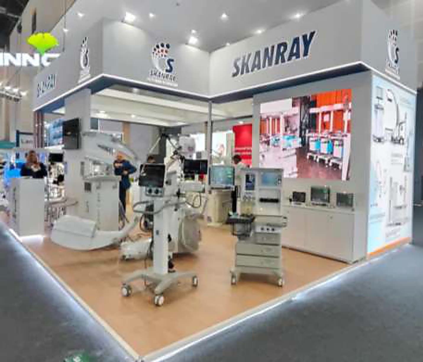 Medical technology stand with equipment displayed on an open timber floor